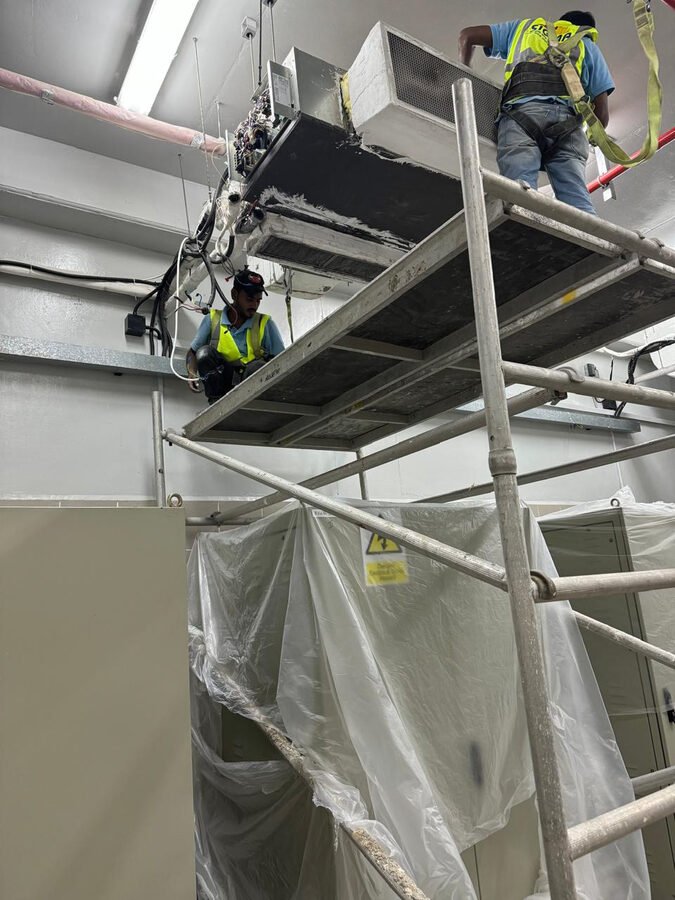 HVAC unit installation on scaffold